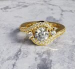 Asymmetrical round brilliant-cut diamond engagement