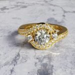 Asymmetrical round brilliant-cut diamond engagement
